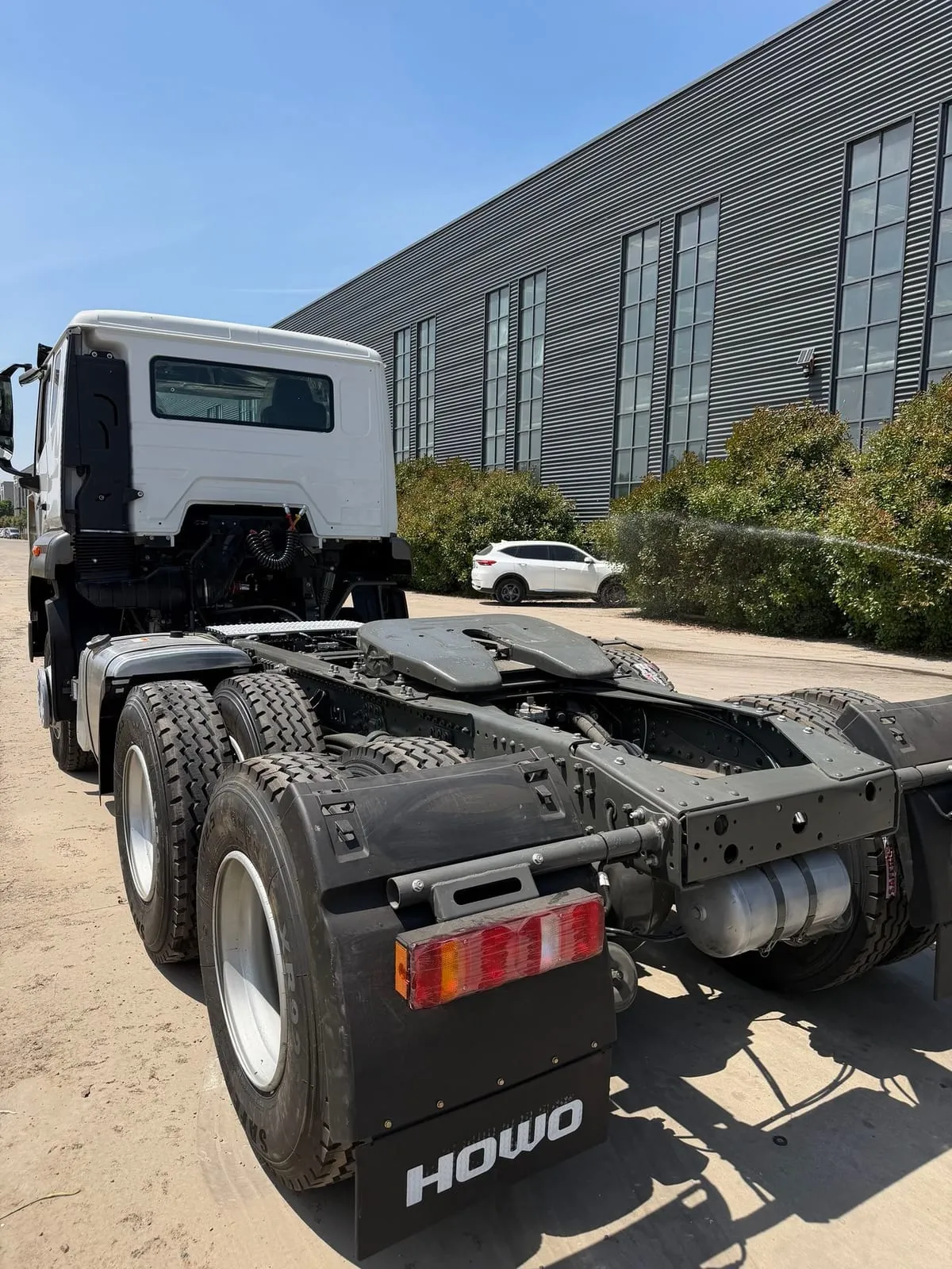 Used HOWO 6x4 heavy tractor head paired with low-bed semi-trailer
