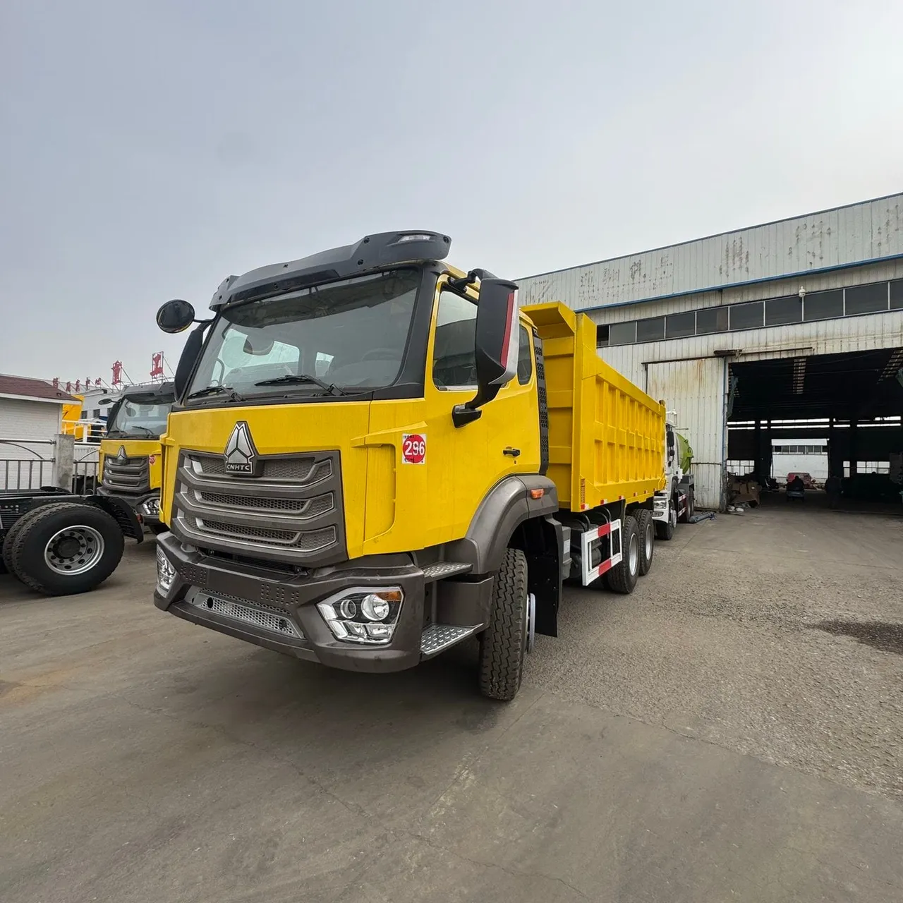 Used HOHAN 8x4 dump truck, extended body, triple rear axle, China export yard