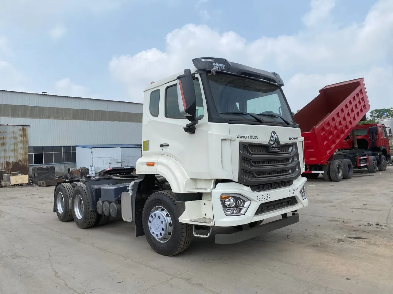 Used HOWO NX 6x4 tractor truck in red cab ready for export, semi-trailer prime mover